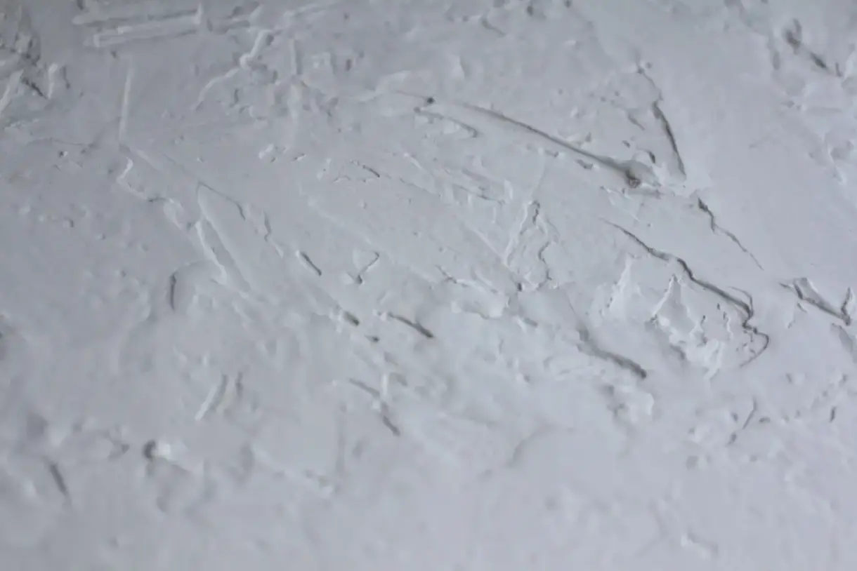 Popcorn textured ceiling surface before removal begins